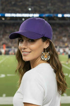 Woman wearing Bengal Tiger earrings at football stadium