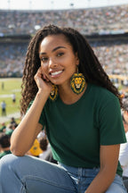 Woman wearing Lion Up earrings at football stadium