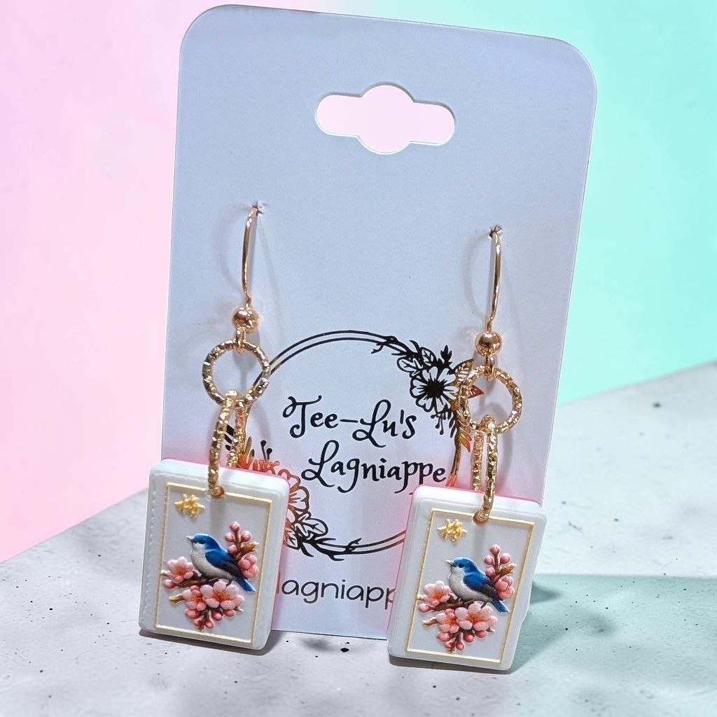 Mahj Blossom Bird earrings - bluebird on cherry blossom mahjong tile, angle view