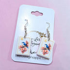 Mahj Blossom Bird earrings - bluebird on cherry blossom mahjong tile, styled view